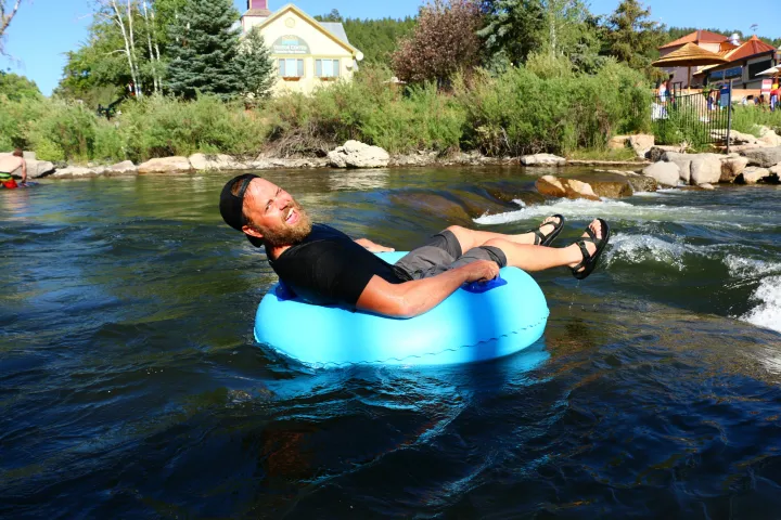 a man tubing on a body of water with pagosa adventure in pagosa springs, colorado