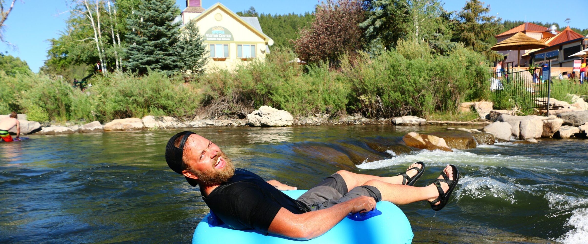 a man tubing on a body of water with pagosa adventure in pagosa springs, colorado