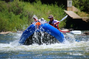 a group of people on a custom raft trip with pagosa adventure in pagosa springs, colorado
