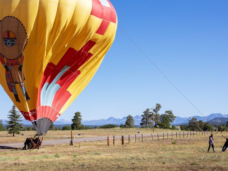 a group of people setting up pagosa adventure's hot air balloon in pagosa springs, colorado