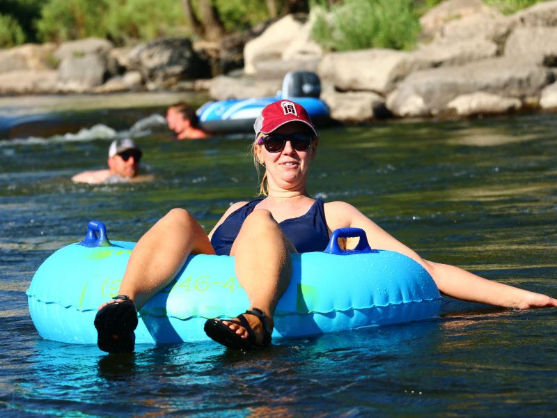 a woman tubing on The San Juan River with Pagosa Adventure in Pagosa Springs, colorado