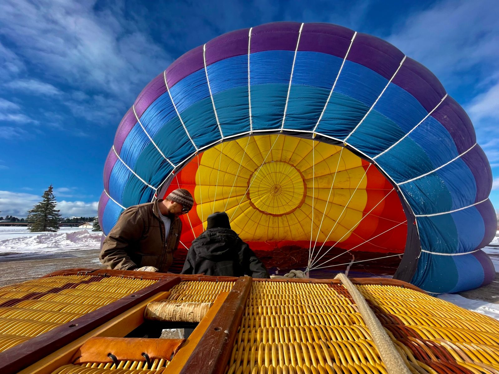 a couple setting up their hot air balloon with pagosa adventure in pagosa springs, colorado