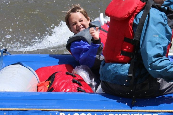 a boy smiling for the camera on a pagosa springs town run with pagosa adventure in pagosa springs, colorado