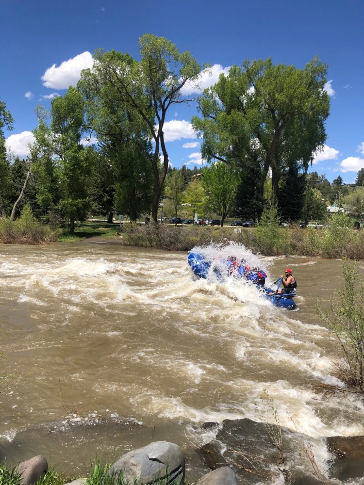 a group of people white water rafting