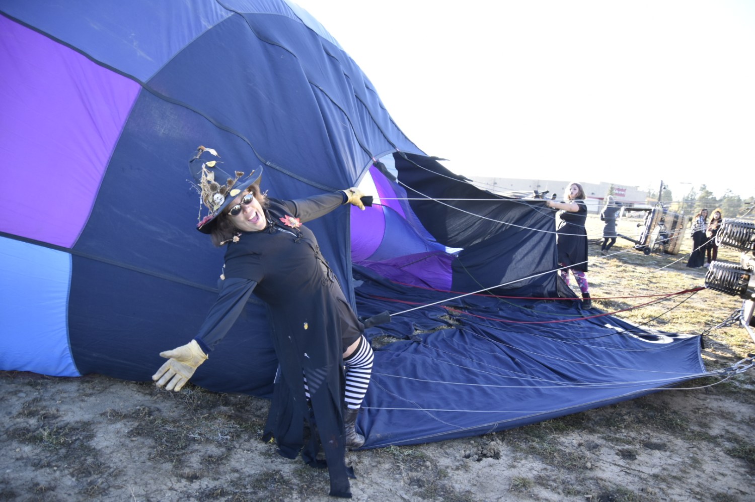 a person lying on a purple umbrella