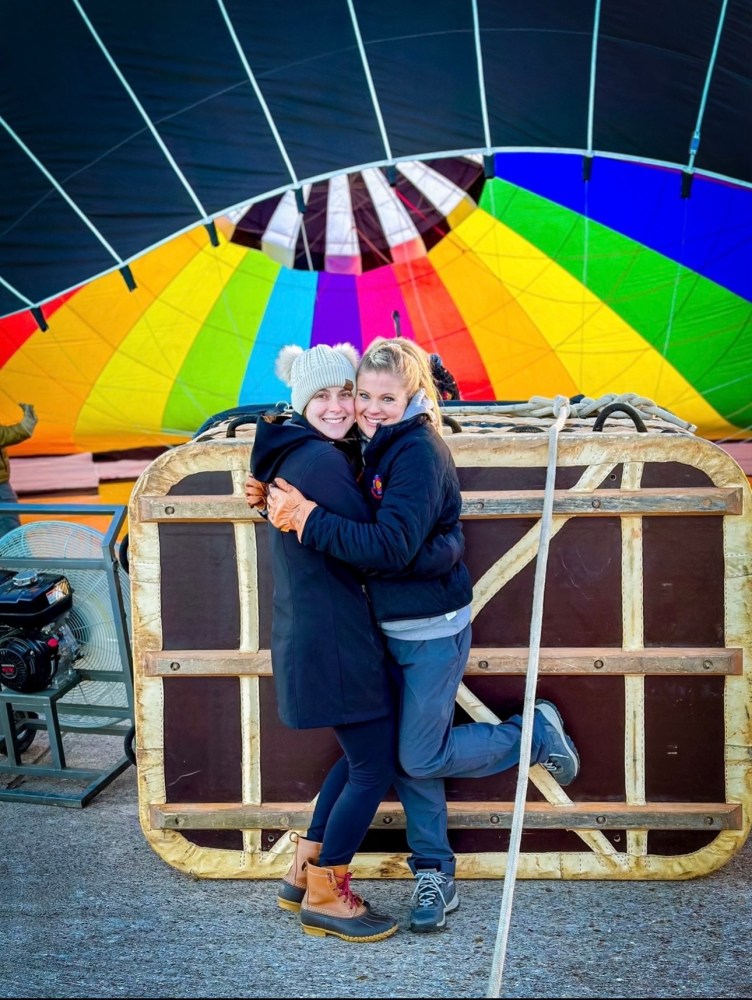 a person holding a colorful umbrella