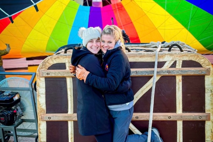 a person holding a colorful umbrella
