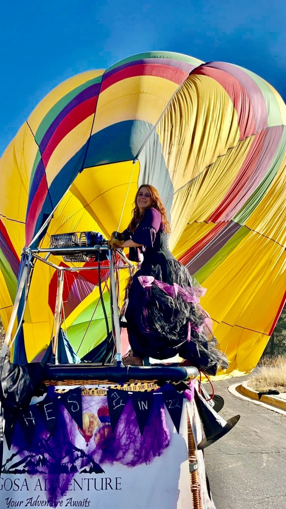 a person holding a colorful umbrella