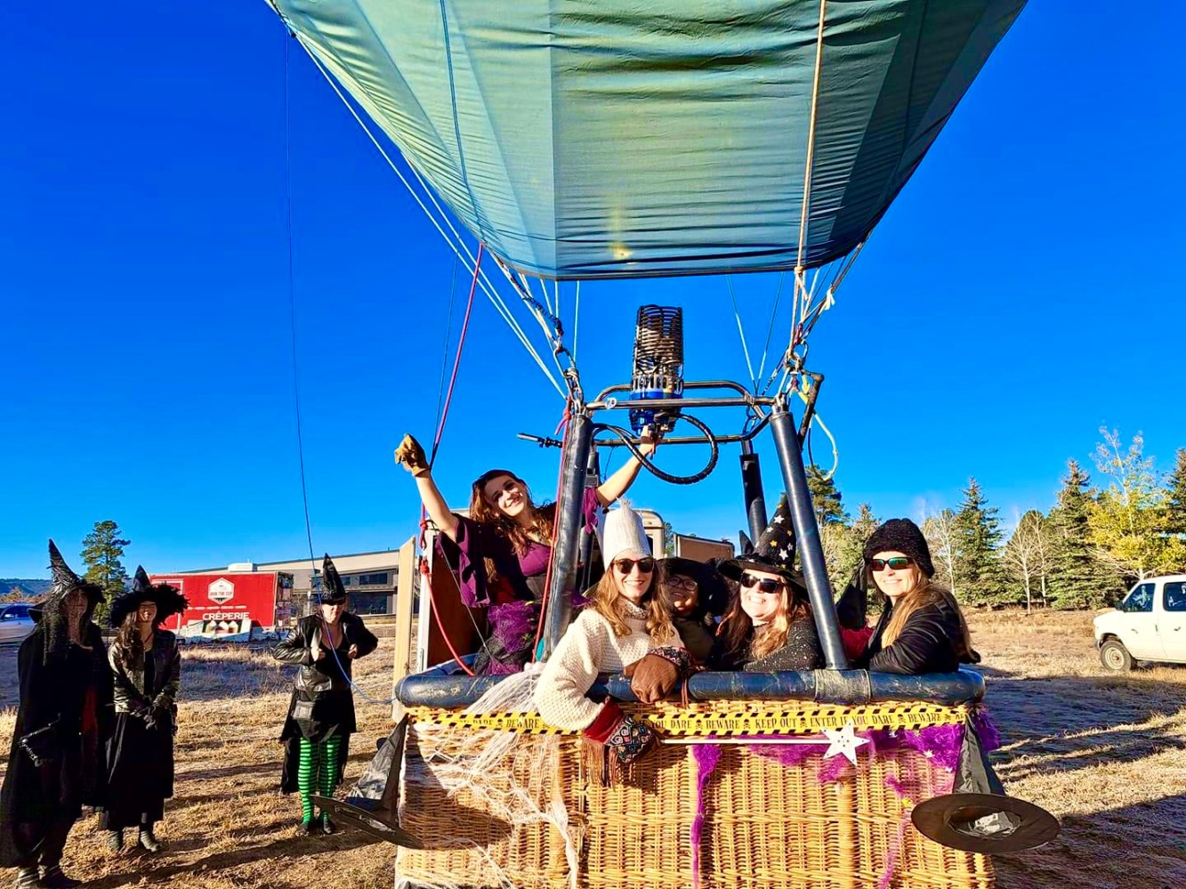 a group of people riding on the back of a truck