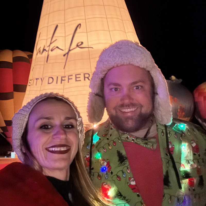 a person wearing a hat and smiling at the camera