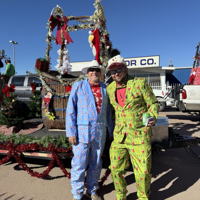 a group of people standing in front of a truck