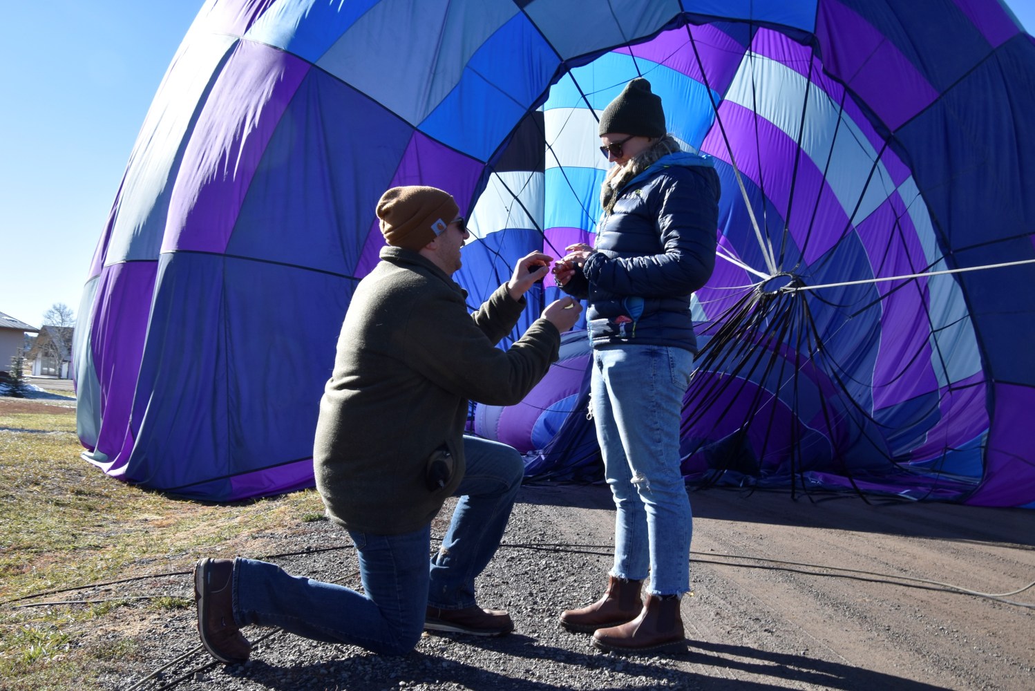 a person holding a purple umbrella