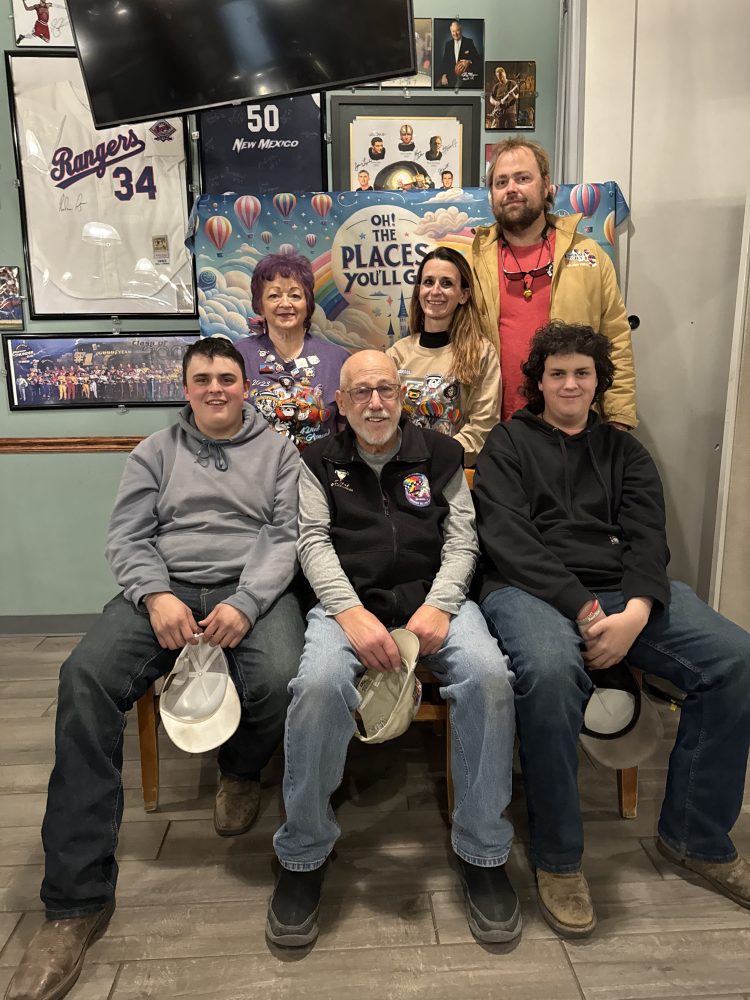 a group of people posing for a photo