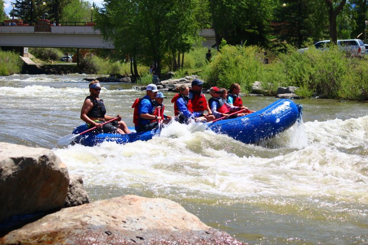 a group of people on a raft in the water