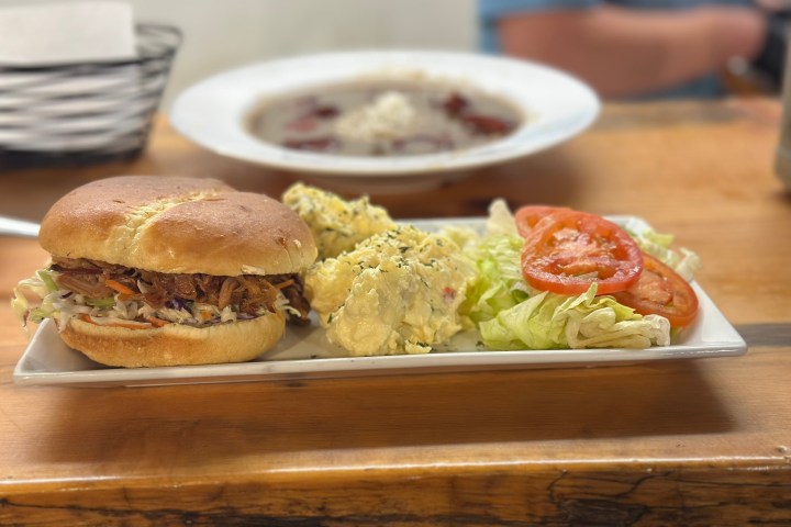 a sandwich sitting on top of a wooden table