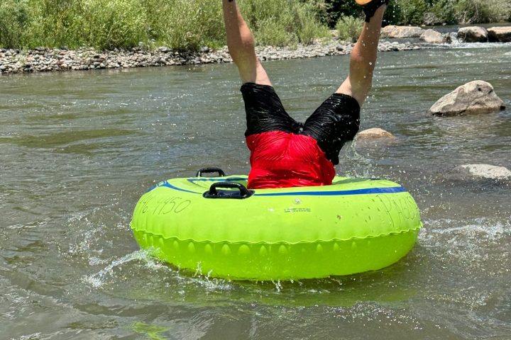 a person riding a surf board on a body of water