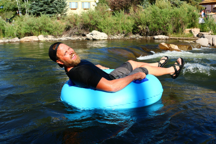 a group of people on a raft in a body of water