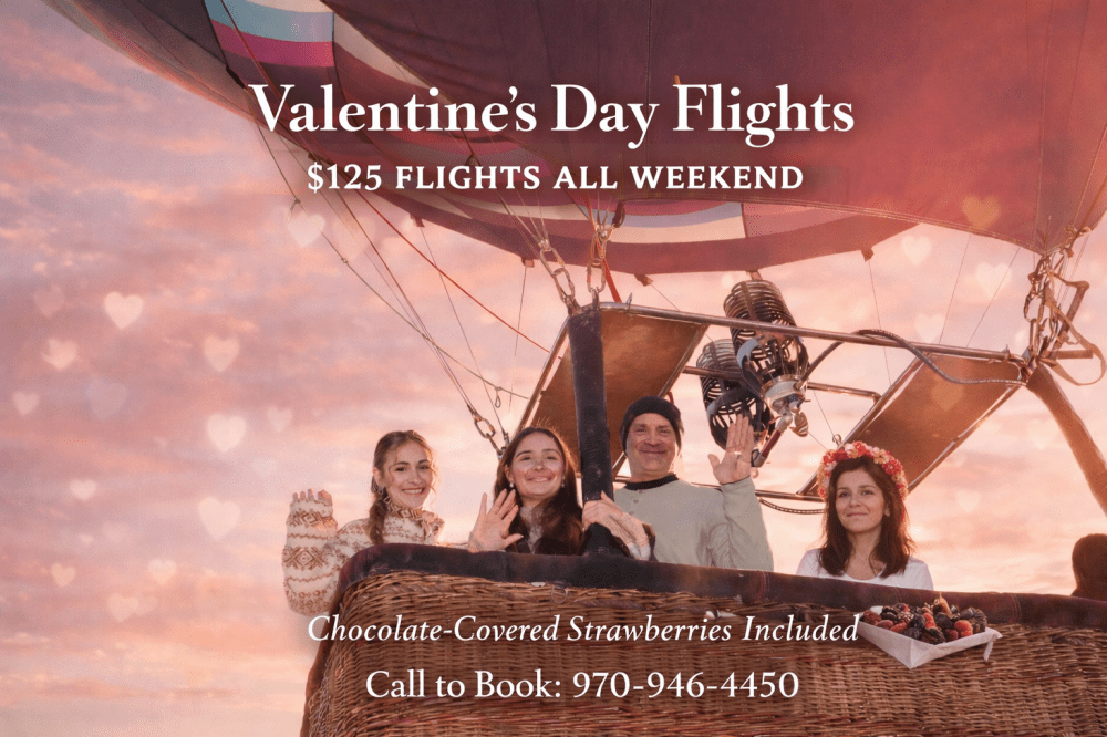 People in hot air balloon with Valentine's Day offer text and heart-shaped sky.